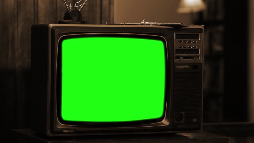 Vintage TV with Green Screen. Sepia Tone. Zoom In. You can replace green screen with the footage or picture you want. You can do it with “Keying” effect in After Effects. | Shutterstock HD Video #1015770871