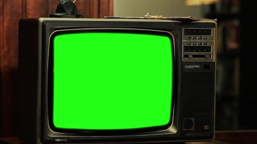 1980s TV with Green Screen. Red Tone. Zoom Out. You can replace green screen with the footage or picture you want. You can do it with “Keying” effect in After Effects. | Shutterstock HD Video #1015771927