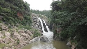 Waterfall in South Africa with slow approach. Manzini, Swaziland. The Heads of Knysna.