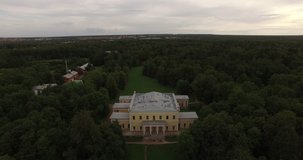 4K summer cloudy afternoon aerial video of old green park and Leuchtenberg's Palace near Peterhof town center and Finnish Bay, in the suburbs of Saint-Petersburg, the Russia's northern capital