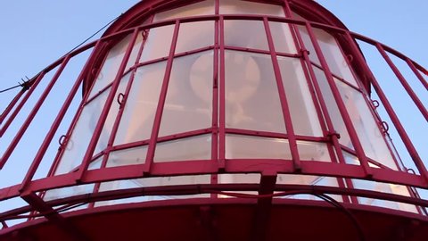 Closeup of Lighthouse top with lamp rotation mechanism in action.