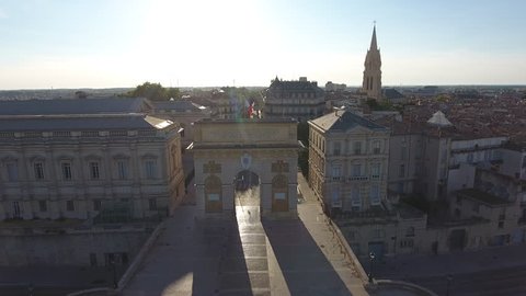 Drone flying through the Arc de Triomphe in Montpellier. One of the gates of the city's old ramparts. Sunny day France