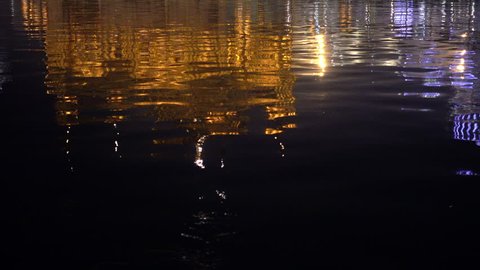 Video of the Golden Temple at sunset reflected in the waters of the lake in Amritsar, Punjab, India. Harmandir Sahib is the holiest pilgrim site for the Sikhs.