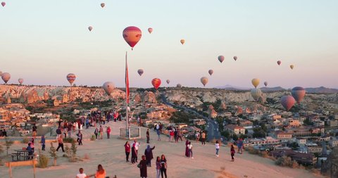 4K Aerial view of Goreme. Colorful hot air balloons flying over the valleys. Famous city Cappadocia, Turkey.