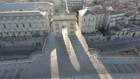 Aerial back travelling Montpellier Ecusson arc de triomphe. Early morning France.