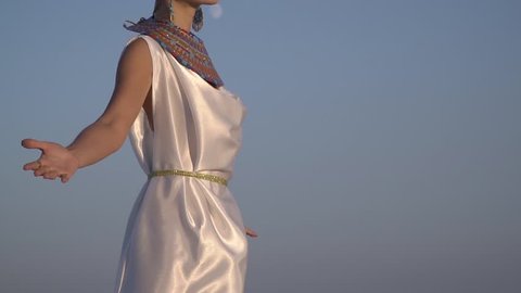 Slow-motion shooting, Pharaoh's wife in traditional clothes meets the dawn