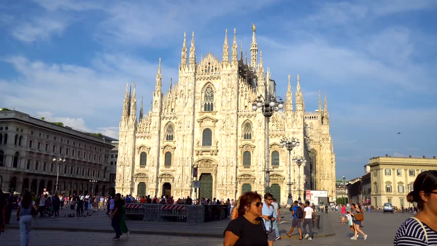 Milan, Italy - 14.08.2018: Tourists visiting the Piazza Duomo square in Milan | Shutterstock HD Video #1015822582