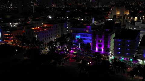 MIAMI BEACH, FLORIDA, USA - AUGUST 29, 2018: Night aerials of Miami Beach Ocean Drive hotels and night clubs