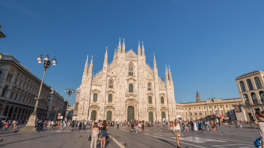 MILAN, ITALY - JULY 16, 2017: Milan Italy time lapse 4K, city skyline timelapse at Milano Duomo Cathedral | Shutterstock HD Video #1015834855