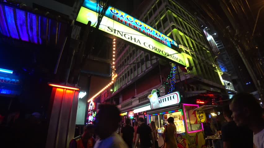 BANGKOK,  THAILAND - CIRCA AUGUST 2018 : View of walking SOI COWBOY street near Asok train station.  This street is famous for night spot. | Shutterstock HD Video #1015836589