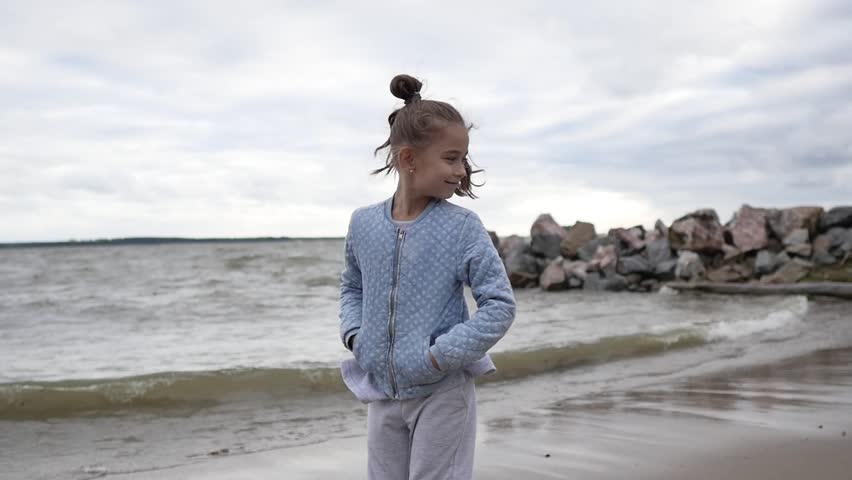 Little girl is smiling at the camera