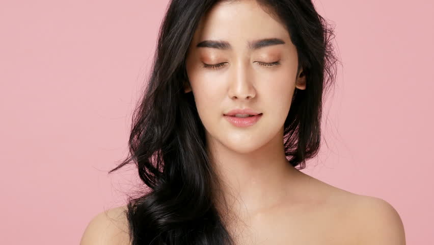 Portrait of beautiful woman with happy emotion at pink background. People with beauty, healthy, fashion concept. 4k resolution. | Shutterstock HD Video #1015883902