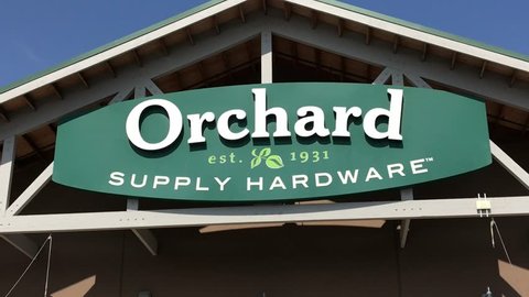 LOS ANGELES, Sep 1,2018: Close up of an OSH Orchard Supply Hardware store sign and logo above a West LA store, then pan down to entrance and customers entering store. The chain is set to close October