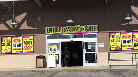 LOS ANGELES, Sep 1, 2018: Pan up from entrance of an OSH Orchard Supply Hardware store surrounded with final sale signs, to store sign above entrance. The chain is set to close for good Oct 20th.