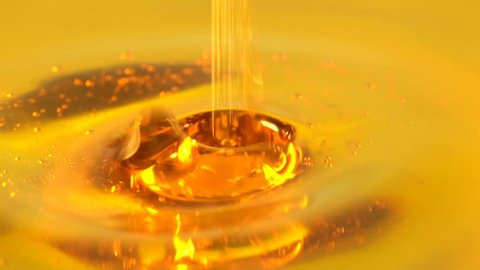 Closeup of Motor oil pouring in slow motion
