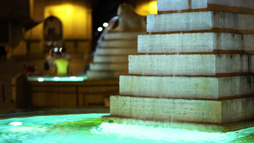 Beautiful night fountain in Piazza del Popolo in the summertime. Italian fountain. Rome, Italy.