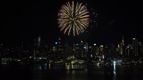 Night shot of upper New York Bay area. Cityscape skyline. Spectacular fireworks. Manhattan