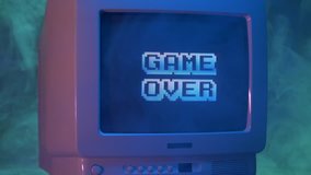 GAME OVER title on a tube TV Vintage 80's 90's arcade.Zooming out with fog giving a retro look at the scene. - Powered by Shutterstock - Get 15% off with code: PIKWIZARD15