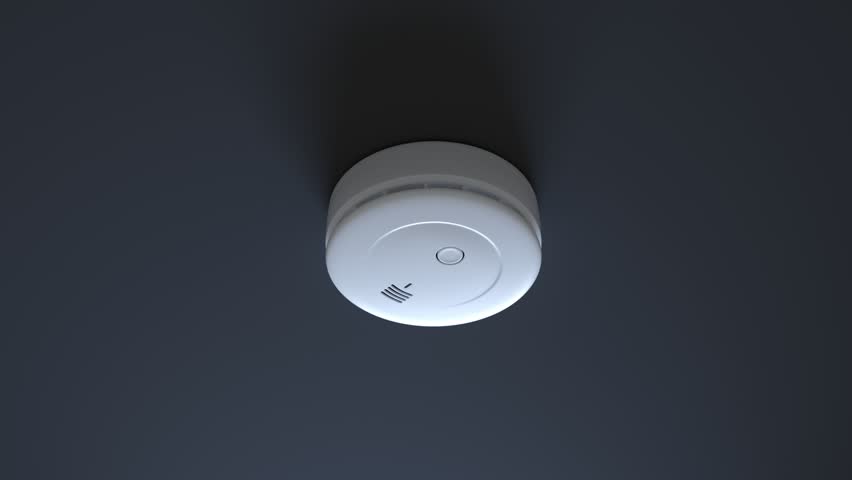 Dense smoke gathering around and surrounding a smoke detector on a white ceiling. Alarm activates, red and yellow lights are blinking suDense smoke gathering around and surrounding a smoke detector on Royalty-Free Stock Footage #1015905697