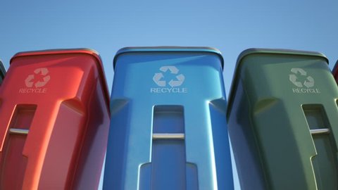 Colorful, plastic garbage bins, with recycle logo on the front, stacked in a row against a clear blue sky background in an endless, loop. Symbol of recycling, waste sorting and saving the environment.