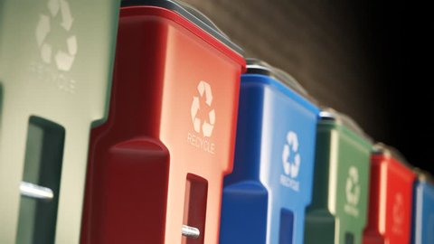 Colorful, plastic garbage bins, with recycle logo on the front, stacked in a row against a brick wall in an endless, loop. Symbol of recycling, waste sorting, ecology and saving the environment.
