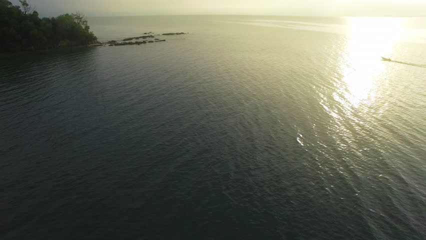 Aerial view of Tanjung Kubong tropical beach with rocks formation located at the northern tip of Labuan Island with waves breaking over the reef in Labuan island,Malaysia.