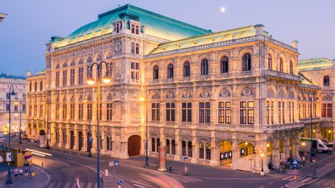Vienna opera house at sunset. Time lapse. Camera moves from left to right. Change day to night.