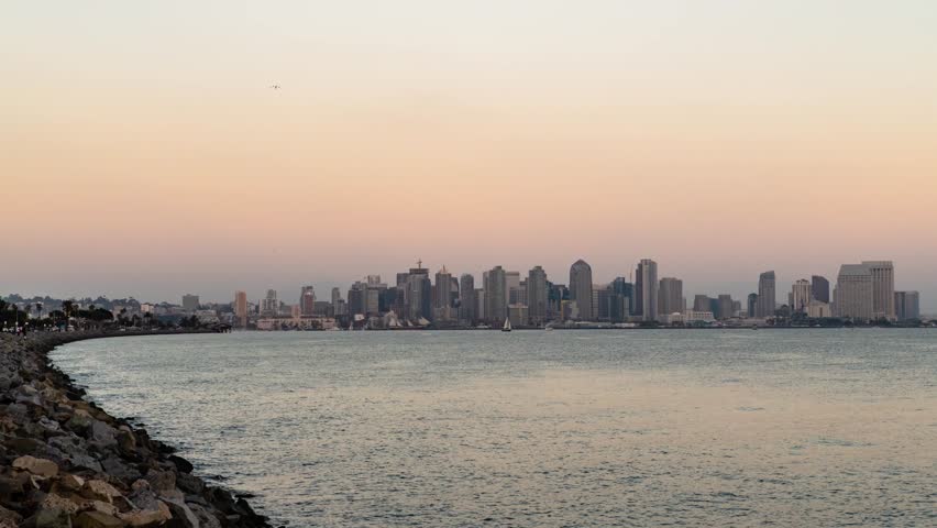 August 2018 - San Diego, California - City Time Lapse Sunset with Full Moon Rising in the Distance