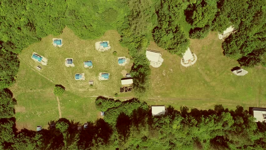 Aerial view of a summer camp with cabins in the wood at Slovenia.