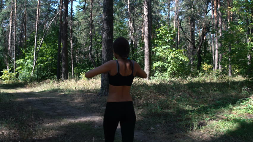 Beautiful girl doing sports in nature, sports in the woods