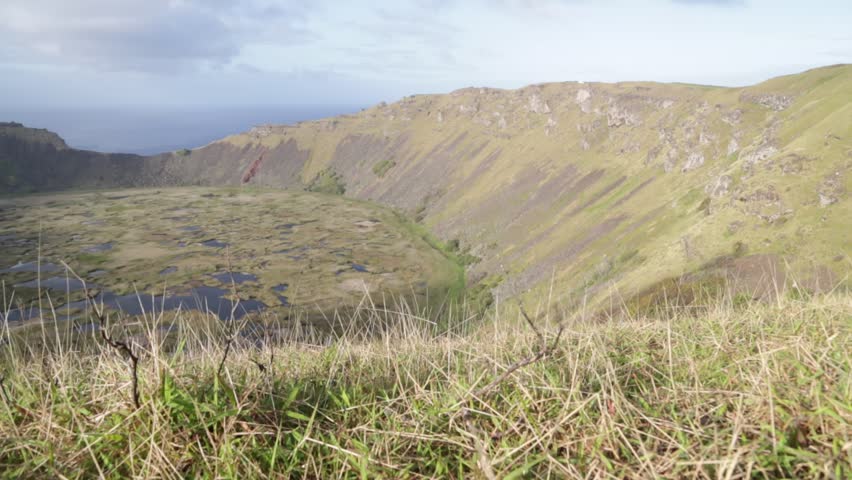 in chile rapa nui the antique and mysteriuos volcano and lake near ocean nature and park
