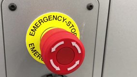 Hand pressing emergency stop button - Powered by Shutterstock - Get 15% off with code: PIKWIZARD15