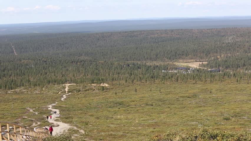Urho Kekkonen national park seen from the Kiilopää, hikers, in the background the ski center