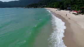 Drone footage. Thailand. Koh Phangan island. Haad yuan beach. Top view aerial video of beauty nature landscape with beach, sea and jungle.