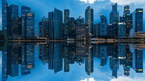 Time lapse of cityscape and reflections at night in Singapore. 4K