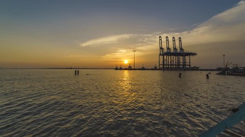 26th aug 2018, tanjung harapan, heavy duty crane on standby mode with  beautiful sunset scene in background.