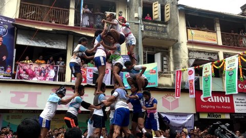 Mumbai /India 03 September 2018 Girls Devotees try to form a human pyramid to break a clay pot during Dahi Handi celebrations at Dadar Mumbai Maharashtra India