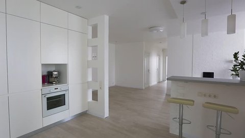 Home interior walk through from living room into kitchen warehouse conversion empty space modern apartment