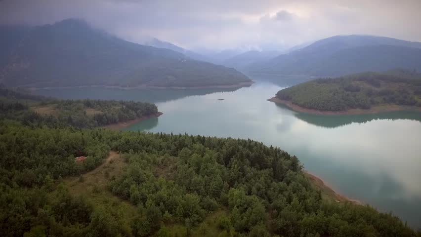 Aerial view of the beautiful Plastiras Lake on a cloudy day in Greece.