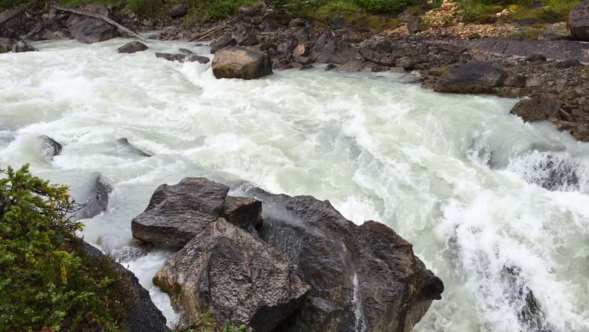 A Flooding Waterfall in the Canadian Backcountry, Close Up Pan