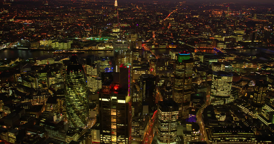 Night shot of London City Centre with Heron Tower and famous skyscrapers in the first plan. River Thames and London bridges in the background. All covered in beautiful night City lights. Royalty-Free Stock Footage #1015990216