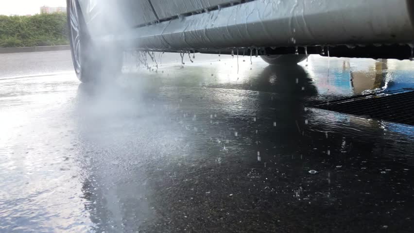 CARWASH manual washing the white car. Water splash. Car reflection.Waterflow | Shutterstock HD Video #1015990714