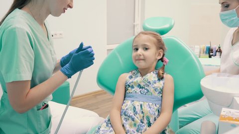 little girl at reception of dentist