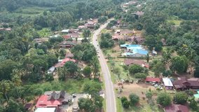 An aerial footage of rural scene landscape in Malacca, Malaysia taken with drone camera. Footage with village valley scene and local house. 
