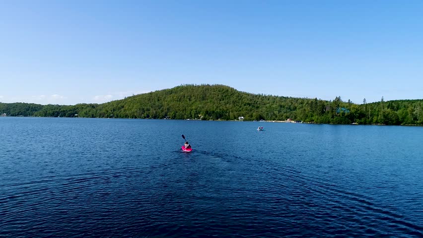 youg man do kayak with a beautiful drone wiew