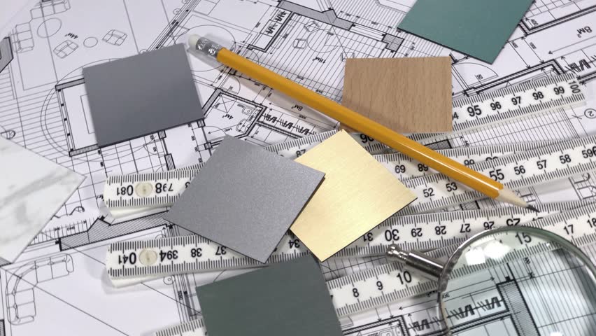 Blueprints: architectural drawings, yardstick - folding ruler & samples of modern interior decoration materials - decorative plastics smoothly rotate on the surface of the architectural plan, an Industrial Video by Viktoriya