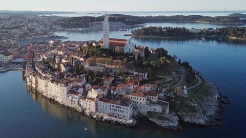 Morning aerial panorama of old town Rovinj, with reflection at the sea. Istria, Croatia.