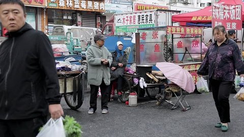 Heihe, Heilongjiang / China. September 05, 2018. Chinese people walking around morning market. Life and travel in China.