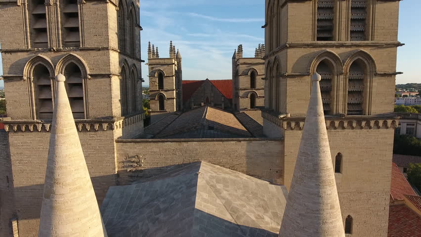 Montpellier Cathedral Saint Pierre down up travelling by drone. Early morning aerial view close up.