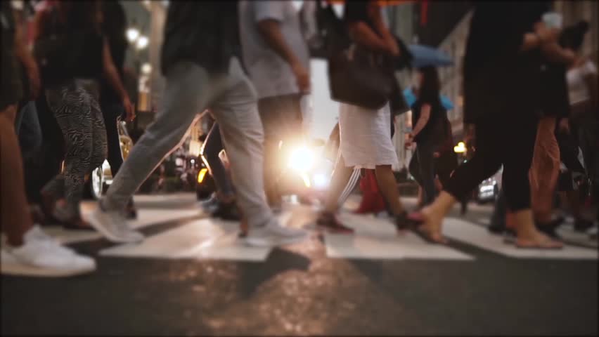 Atmospheric slow motion shot of big crowd legs crossing a busy city street near Times Square, New York in the evening. Royalty-Free Stock Footage #1016040703